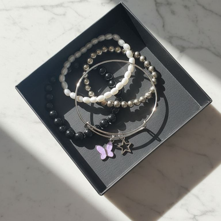 Pink butterfly bangle and bracelet stack