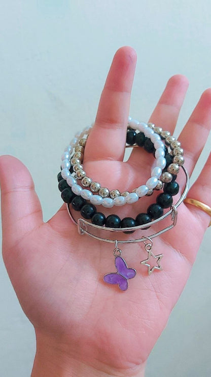 Pink butterfly bangle and bracelet stack