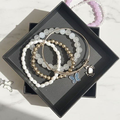 Black butterfly bangle and bracelet stack
