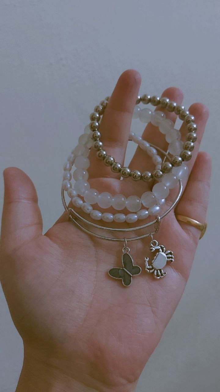 Black butterfly bangle and bracelet stack